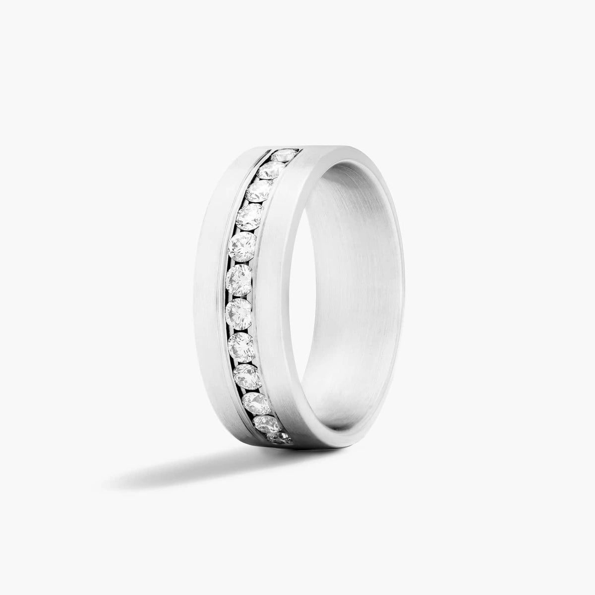 Men's sterling silver wedding band with channel-set round moissanite stones
